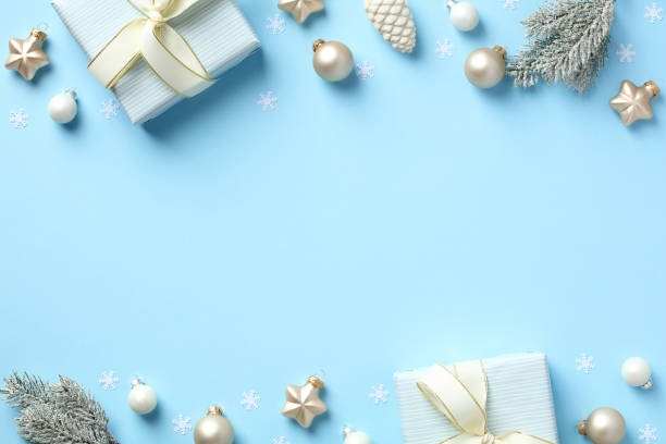 istock Blue Christmas background with gift boxes, baubles, fir branches. 1436637486