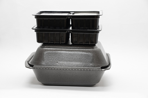 plastic food container with sushi from restaurant on isolated background, takeaway food order