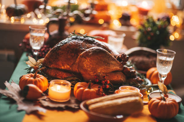 istock Thanksgiving holiday dinner table setting with fall decoration and pumpkins 1436639990