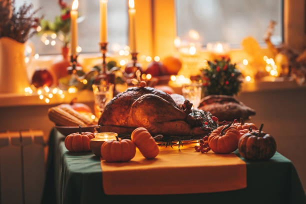 istock Thanksgiving holiday dinner table setting with fall decoration and pumpkins 1436639997