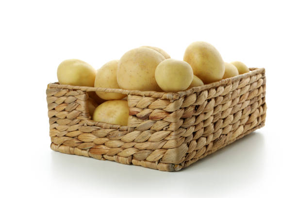 istock Basket of young potato isolated on white background 1436640246