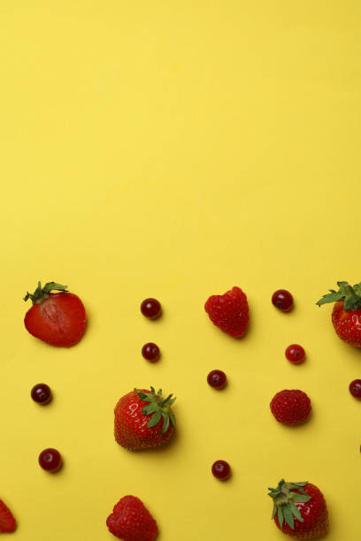 istock Delicious fresh berry mix on yellow background 1436641263