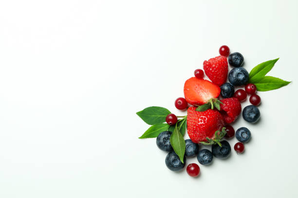 istock Delicious fresh berry mix on white background 1436641985