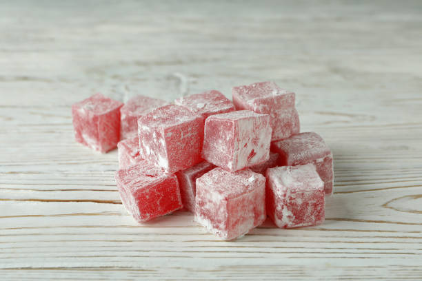 istock Delicious turkish delight cubes on wooden background 1436648204