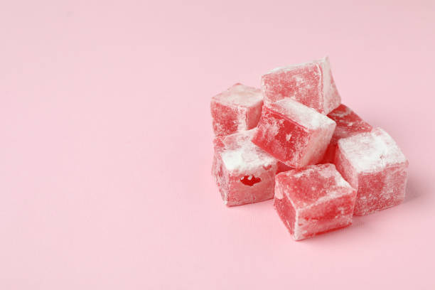 istock Delicious turkish delight cubes on pink background 1436648296