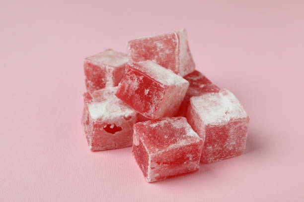istock Delicious turkish delight cubes on pink background 1436648823