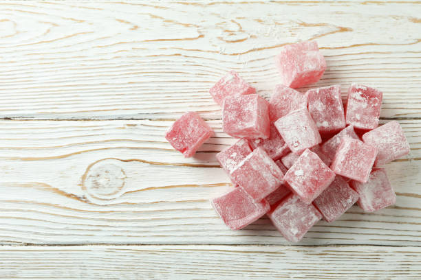 istock Delicious turkish delight cubes on wooden background 1436649033