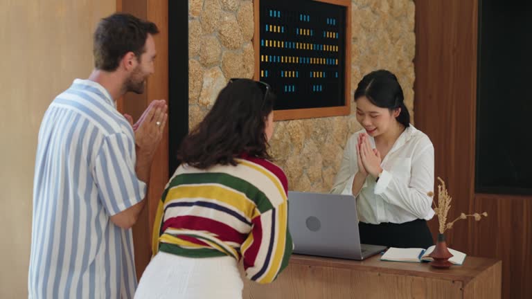 Hostess welcoming guests to the luxury villa