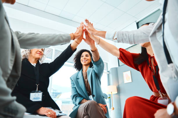 istock Support, community and high five with business women in teamwork workshop for innovation, networking and partnership growth. Goals, future and mission with employees in global team building meeting 1436650789