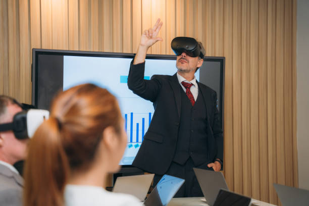 istock During the workplace meeting, the business team used a virtual reality headset. 1436651936