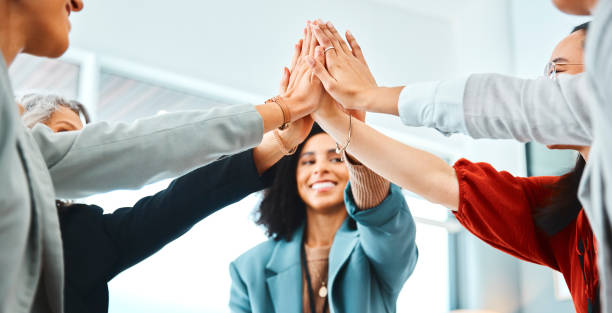 istock Hands, high five and team building in office with workers connecting in support of success and fun. Teamwork, collaboration and hand in solidarity of community goal, vision and mission for success 1436653984
