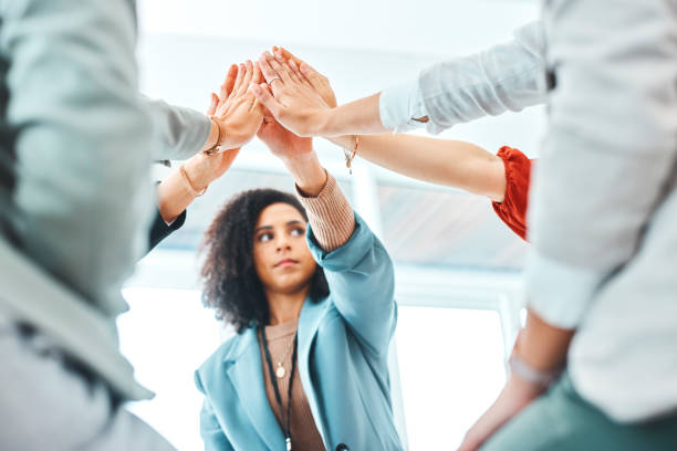 istock High five, success or business people in team building, collaboration or teamwork diversity in creative startup, company or office. Women, workers or in support, trust and mission for designer growth 1436653993
