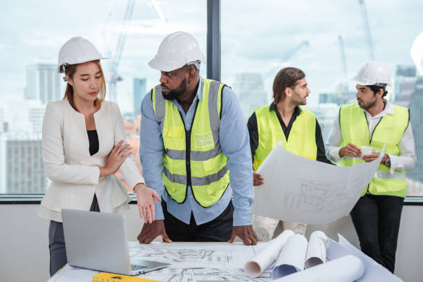 istock Engineers meet in the office to work on an architectural project as a team. 1436654030