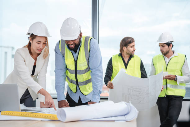 istock Engineers meet in the office to work on an architectural project as a team. 1436654086