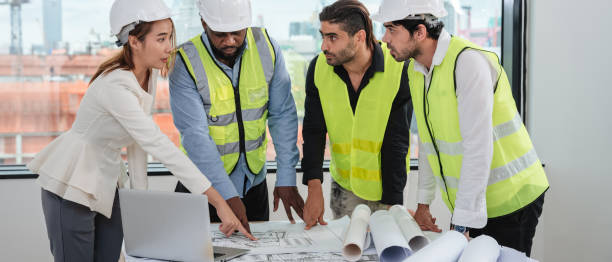 istock Engineers meet in the office to work on an architectural project as a team. 1436654120