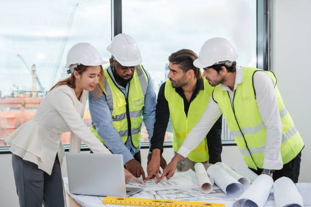 istock Engineers meet in the office to work on an architectural project as a team. 1436654159