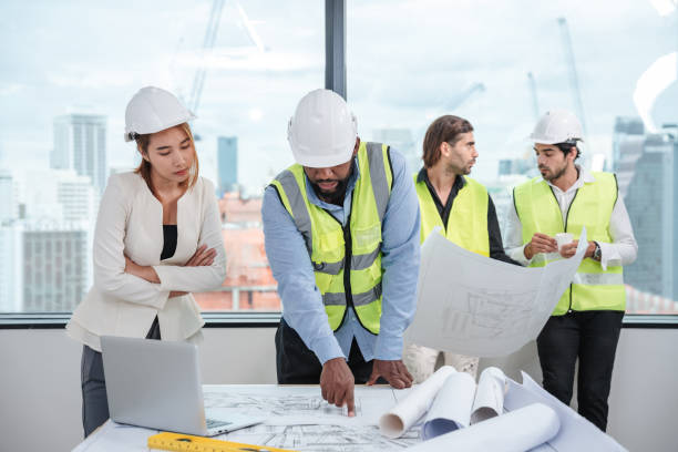 istock Engineers meet in the office to work on an architectural project as a team. 1436654223