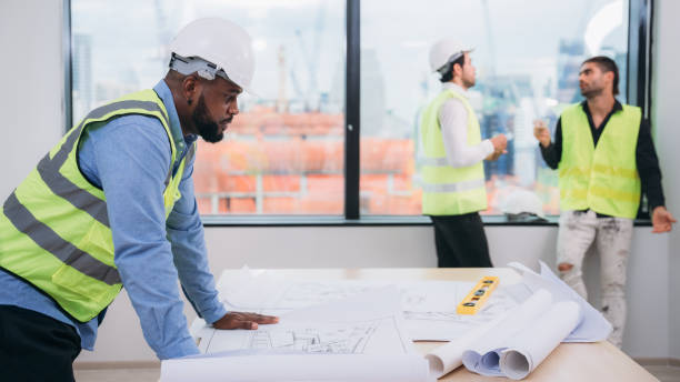 istock Engineers meet in the office to work on an architectural project as a team. 1436654871
