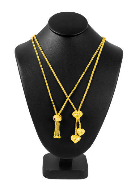 istock The Gold necklace on necklace display stand isolated on white background, Save Clipping path. 1436655761