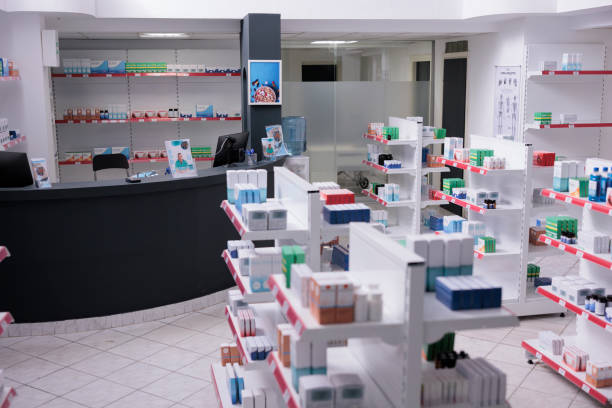 istock Bright empty drugstore equipped shelves full of supplements 1436657391