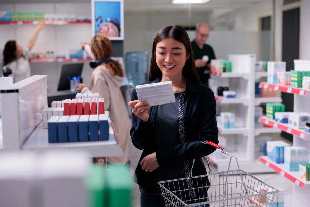 istock Cheerful client holding supplements package reading prescription 1436659202