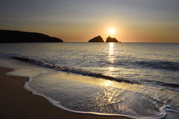 Sunset over Gull Rocks at Holywell Bay in Cornwall