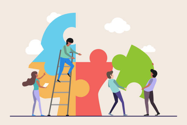 istock Teamowrk connecting jigsaw pieces of head together. collaboration concept 1436660394