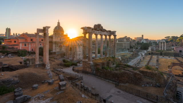 Time lapse Sunrise over the famous Roman Forum. Temple of Saturn in the foreground, Rome Italy,