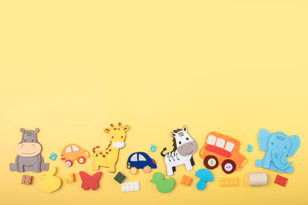 istock Bright multi colored kids toys, details of a plastic constructor, frame on yellow background. Top view. Flatlay. Copy space for text. 1436663057