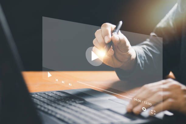 istock Video streaming on internet concept.,man using mouse and keyboard for streaming online on virtual screen,watching video on internet,watching the movies,live concert, show or tutorial, content online 1436665992