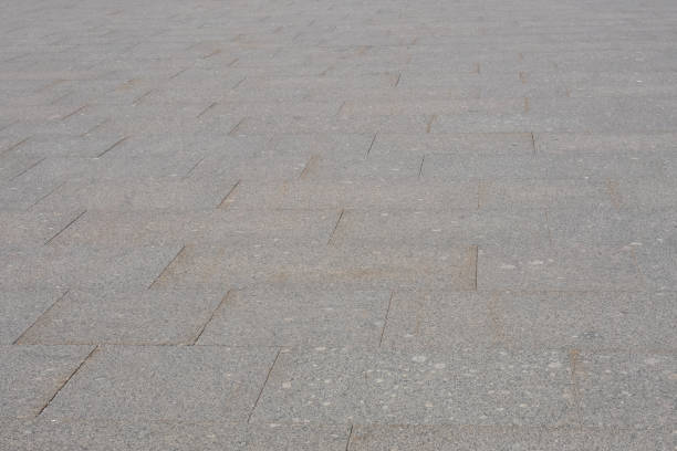 istock Background of old granite road gray tiles 1436667938