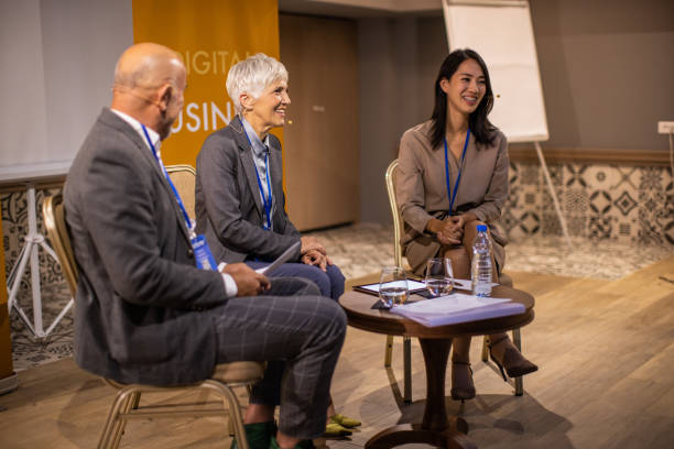 istock Business people attending panel discussion during business conference in convention center 1436669623