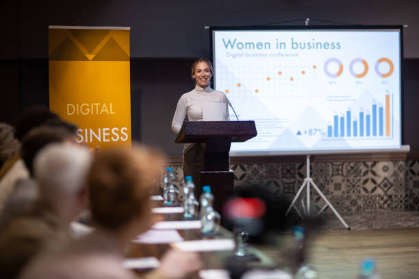 istock Woman speaking at a business conference 1436670041