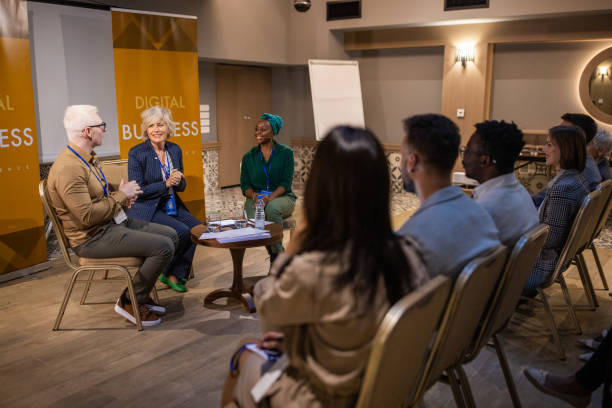 istock Diverse business people having a panel discussion in convention center 1436670161