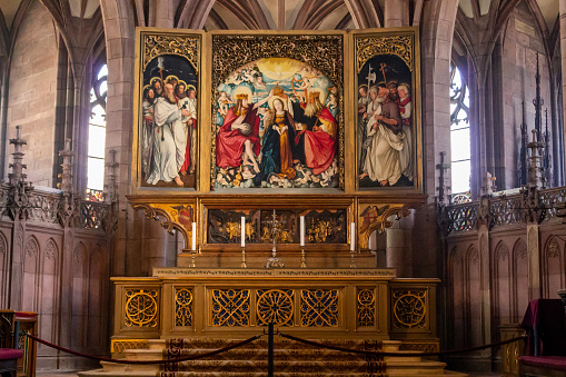 – June 18, 2012: A beautiful paintings on top of an altar of Freiburg cathedral in Breisgau, Germany
