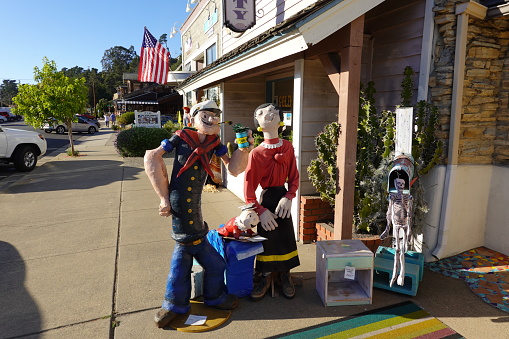 – October 21, 2019: Popeye and friends statues outside of storefront in Cambria California