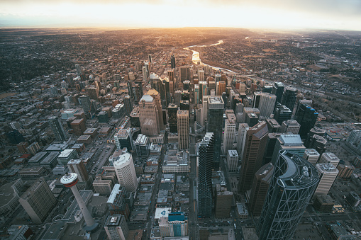Aerial view of the city of Calgary with the sunset on the horizon