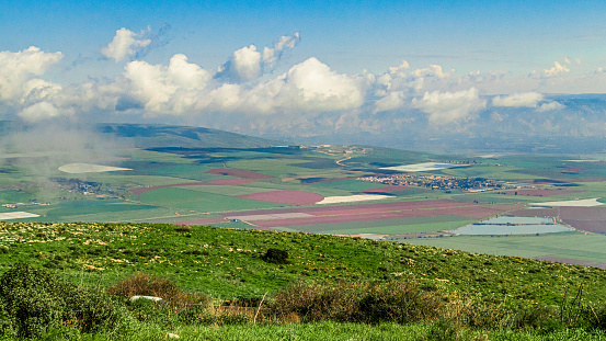 An aerial view of a sunny day over Jezreel Valley in Israel