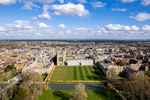 Aerial view of the University of Cambridge, UK, sunny, cloudy, spring, King's College Chapel, River Cam, horizon
