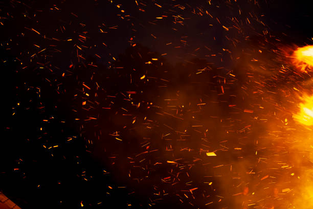 The beautiful shot of fire sparks on a night sky