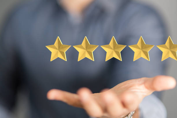 istock Person presenting the virtual projection of five stars ranking 1436676266