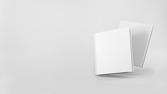 An empty layout of a hardcover white book isolated on a white background. 3D Rendering
