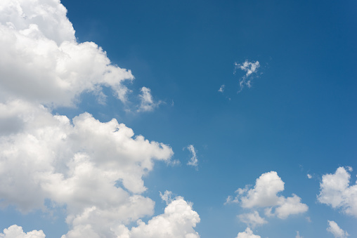 Beautiful blue sky and white fluffy cloud background