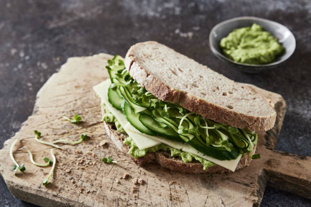 istock Appetizing green vegetarian sandwich on table 1436676976