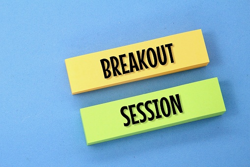 two colored papers with the words breakout sessions Concept