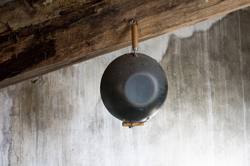 A hanging wok from the ceiling