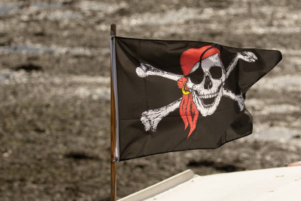Pirate flag flying in the wind.3d illustration. Clipping path included.