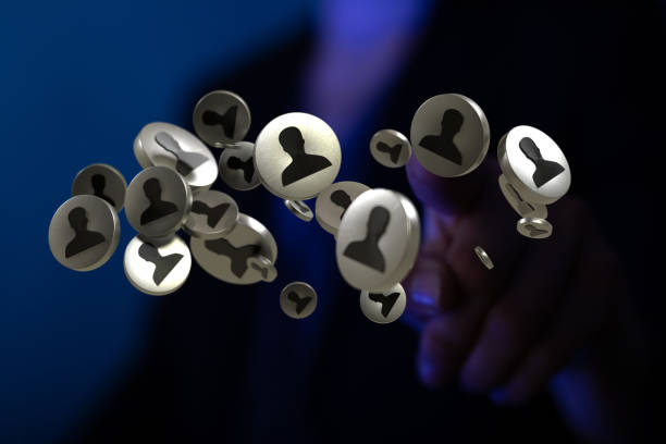 istock Hand reaching out to 3D rendered metallic person icons 1436680250