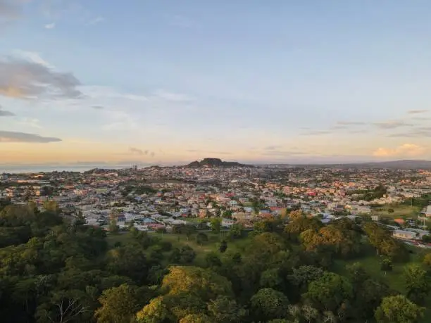 An aerial view of the cityscape of San Fernando against the dusk sky at sunset in Trinidad and Tobago