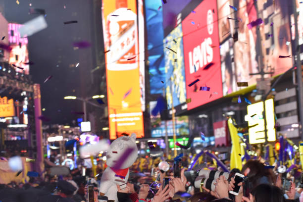 People having fun during New Year's Eve at the Times Square in the New York City New York, United States – January 01, 2020: The people having fun during New Year's Eve at the Times Square in the New York City new years eve new york stock pictures, royalty-free photos & images